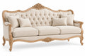 Canapé capitonné à encadrement sculpté et pieds galbés, beige